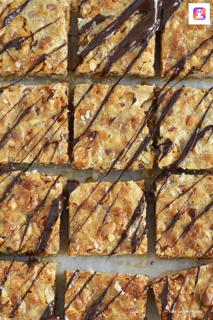 close up of nut bars with chocolate drizzled over the tops.
